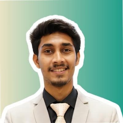 Muhammad Moiz, full-stack developer, smiling in a light grey suit
