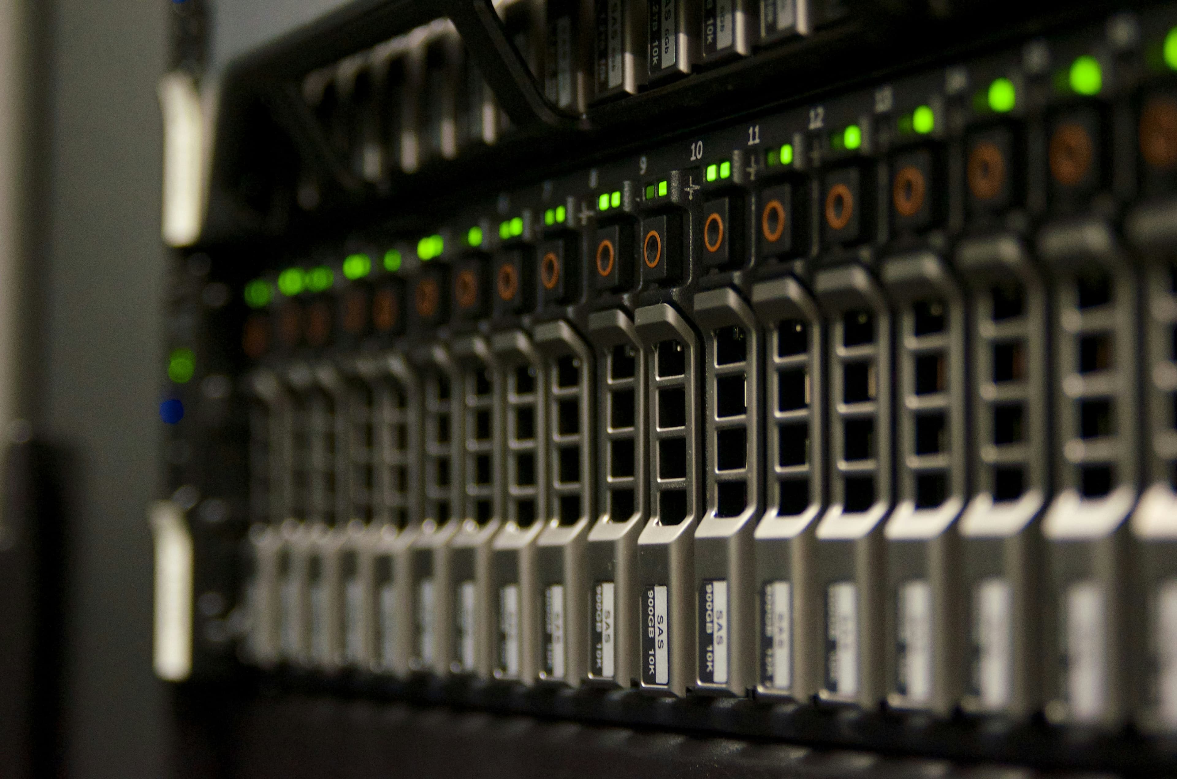 Server rack with rows of blinking green status lights